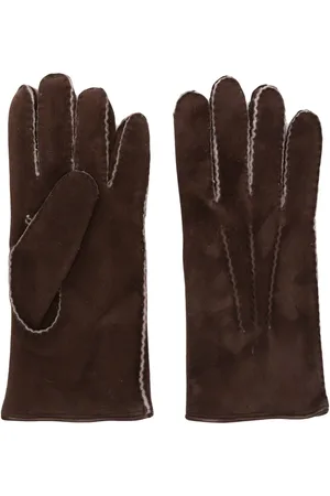 Luxurious contrast-trim suede gloves for men, featuring soft calf suede, whipstitch detailing, and a comfortable fleece lining. These high-quality gloves offer warmth and subtle style. 1 Luxurious contrast-trim suede gloves for men, featuring soft calf suede, whipstitch detailing, and a comfortable fleece lining. These high-quality gloves offer warmth and subtle style.
