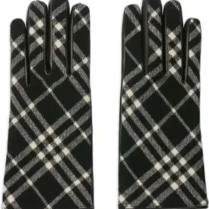 Luxury Check Wool Cashmere Gloves | Burberry Black/Calico Beige

Elevate your winter style with these iconic Check Wool Cashmere Gloves from Burberry. Crafted in Italy, these designer gloves feature a blend of premium wool and soft cashmere, backed with supple grainy calf leather on the palm for a secure grip. Finished with a logo-engraved metal stud and luxuriously lined in cashmere silk, these gloves offer supreme warmth and a press-stud closure for a perfect fit. Ideal for sophisticated warmth and an unmistakable heritage look.